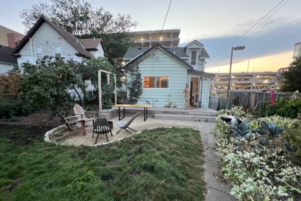 small gravel patio in Phillips Neighborhood surrounded by no mow lawn and edible garden