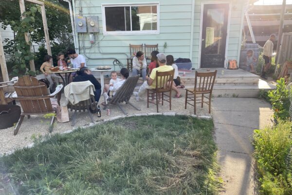 friends gathering in Phillips backyard edible space